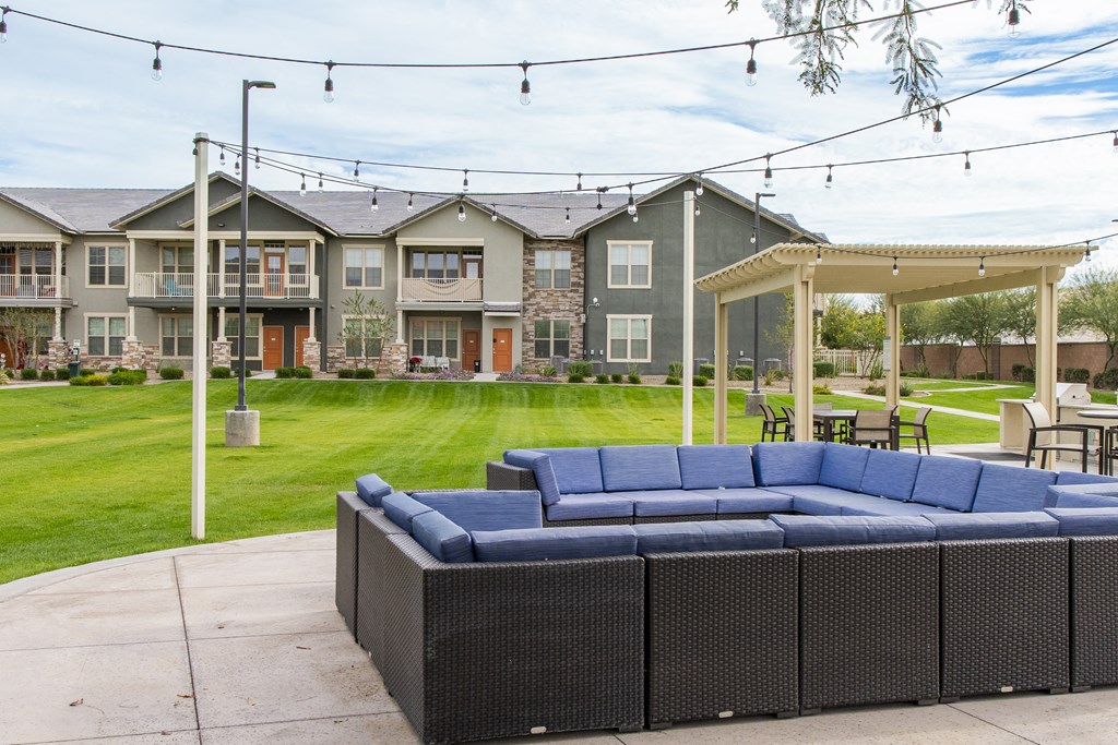 our apartments have a outdoor lounge with a couch and chairs