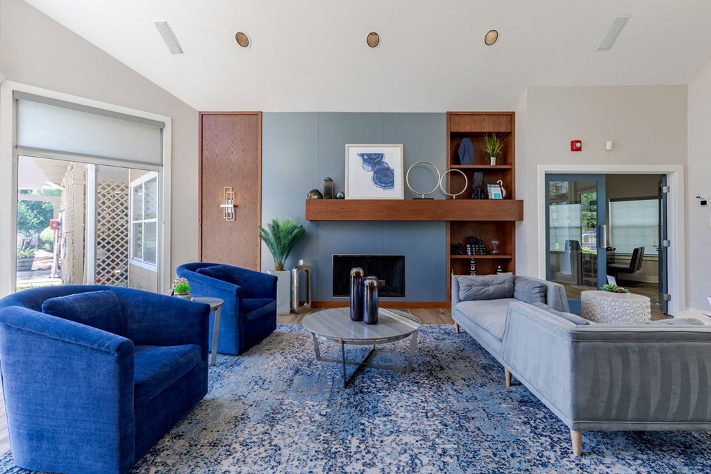 Clubhouse with blue furniture and a blue rug