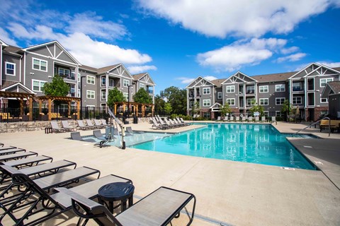 our apartments offer a swimming pool with chaise lounge chairs