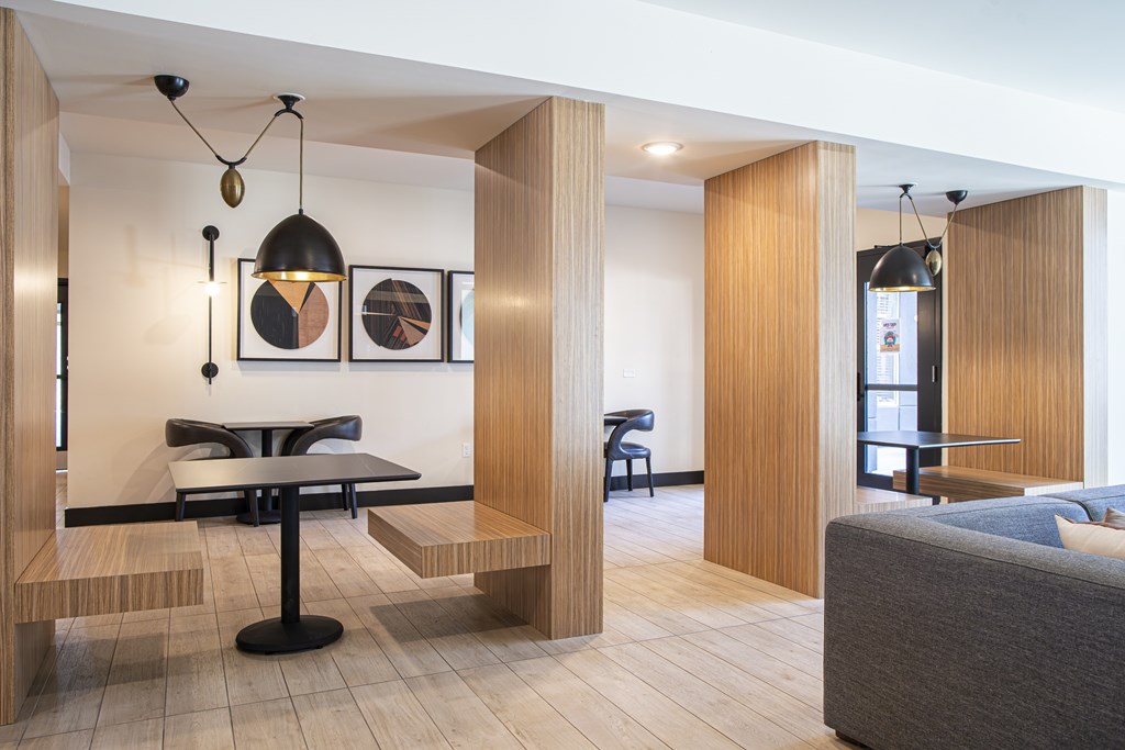 A modern dining area with a table and chairs.