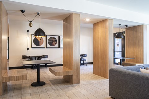 A modern dining area with a table and chairs.