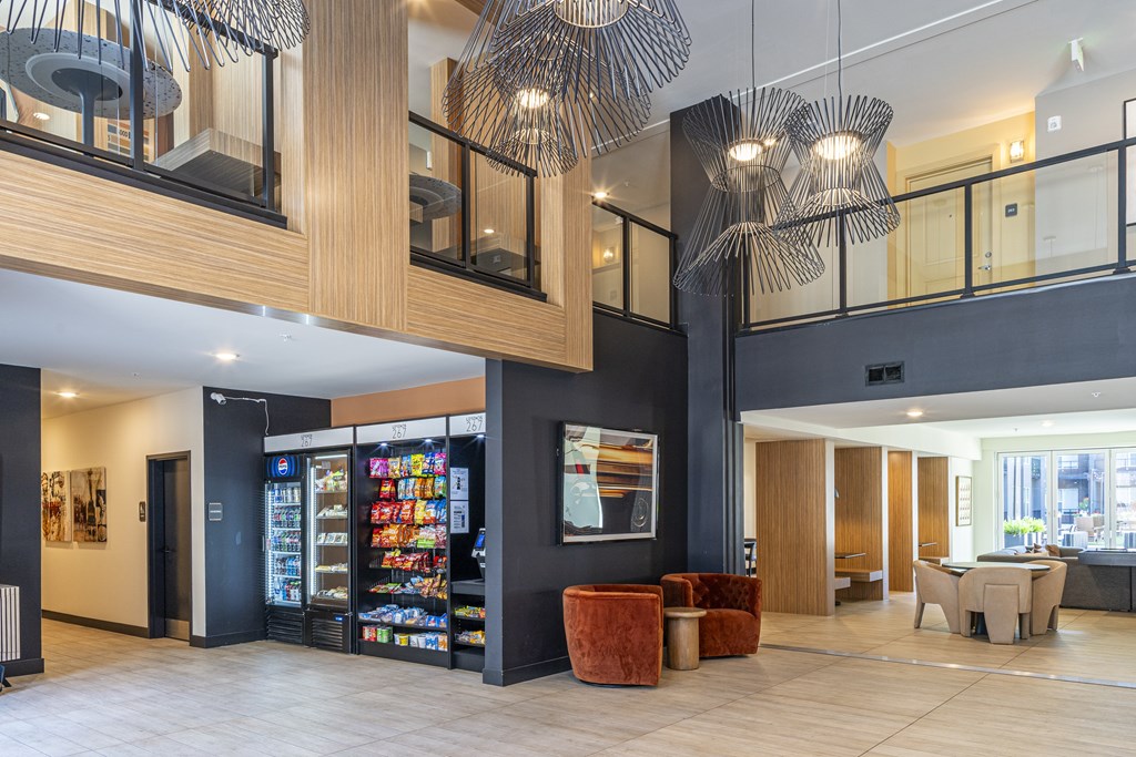 A modern interior with a vending machine and a bar area.