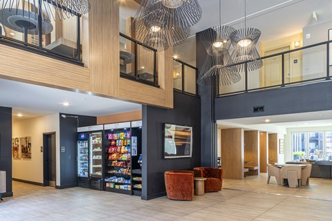 A modern interior with a vending machine and a bar area.