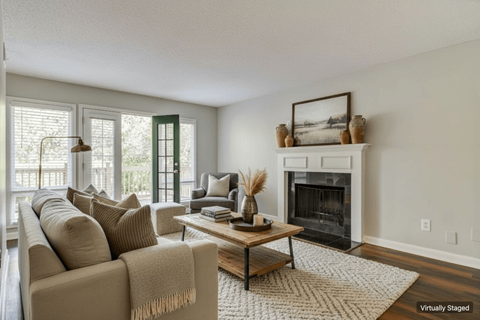 A living room with a fireplace and a couch.