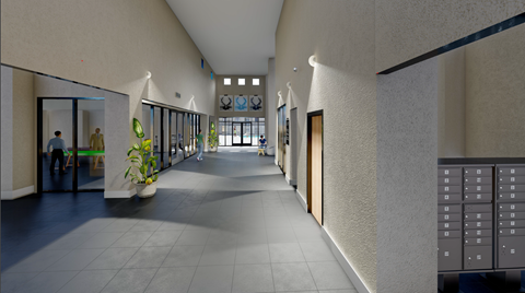 A long hallway with a person standing in the distance.