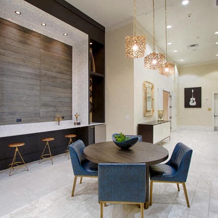 a dining room with a table and chairs