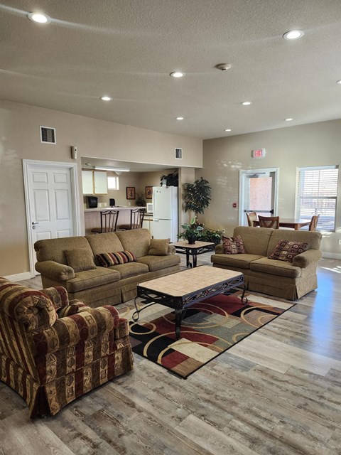 A living room with a couch, chair, and coffee table.