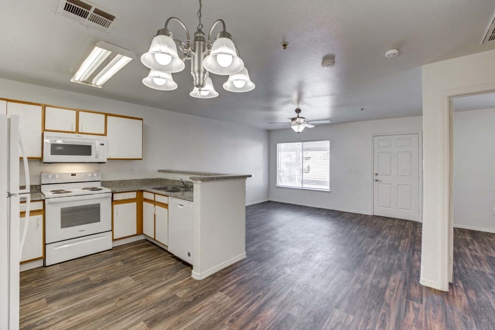 Living Room and Kitchen with white cabinets and appliances