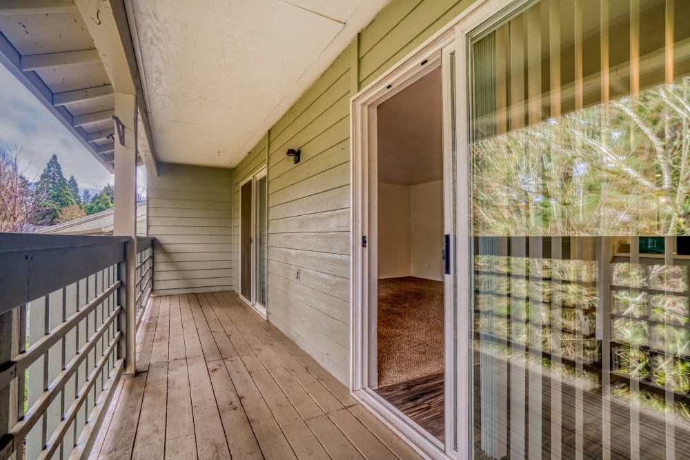 a large glass door and a balcony