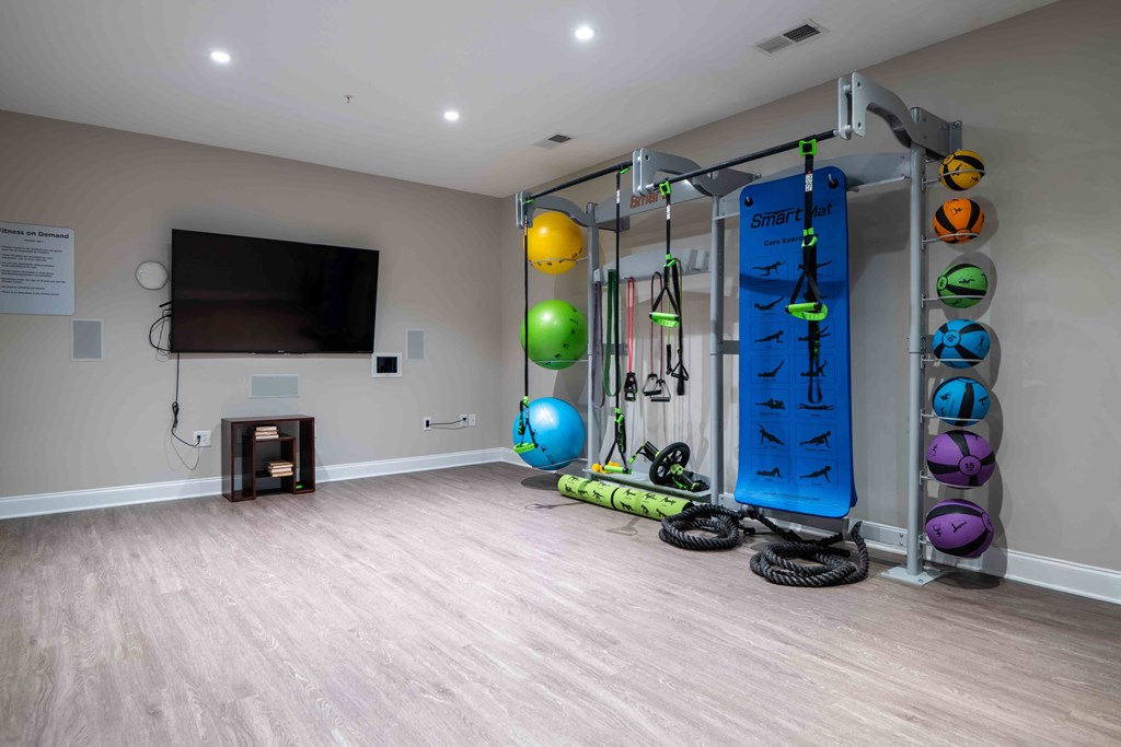 Gym with weights and a television