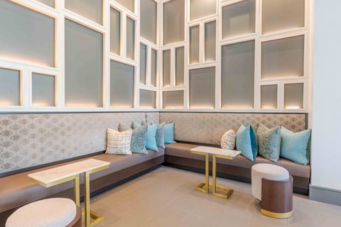 A modern living room with a grey and white color scheme.