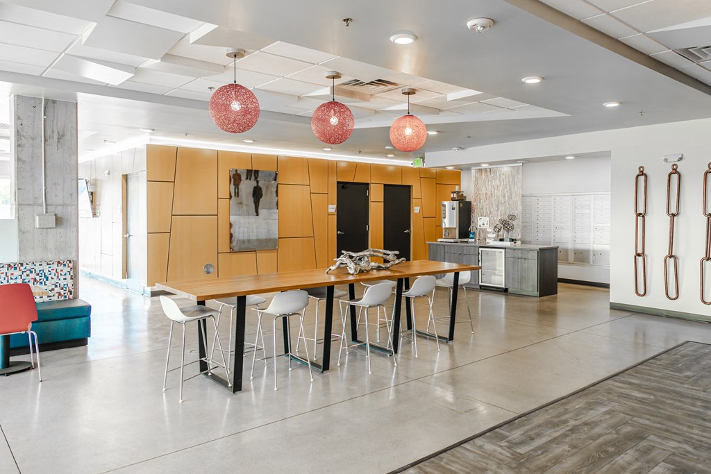 clubhouse with a table and chairs in front of a kitchen