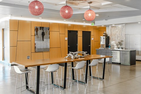 clubhouse  with a long wooden table and chairs