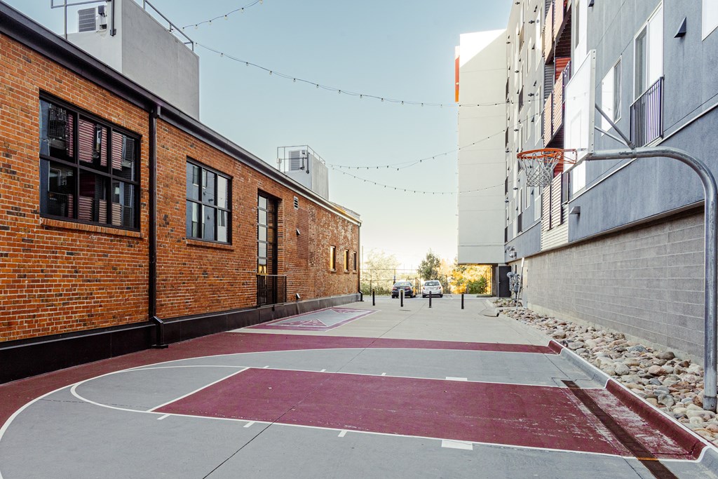 brick buildings and a basketball court