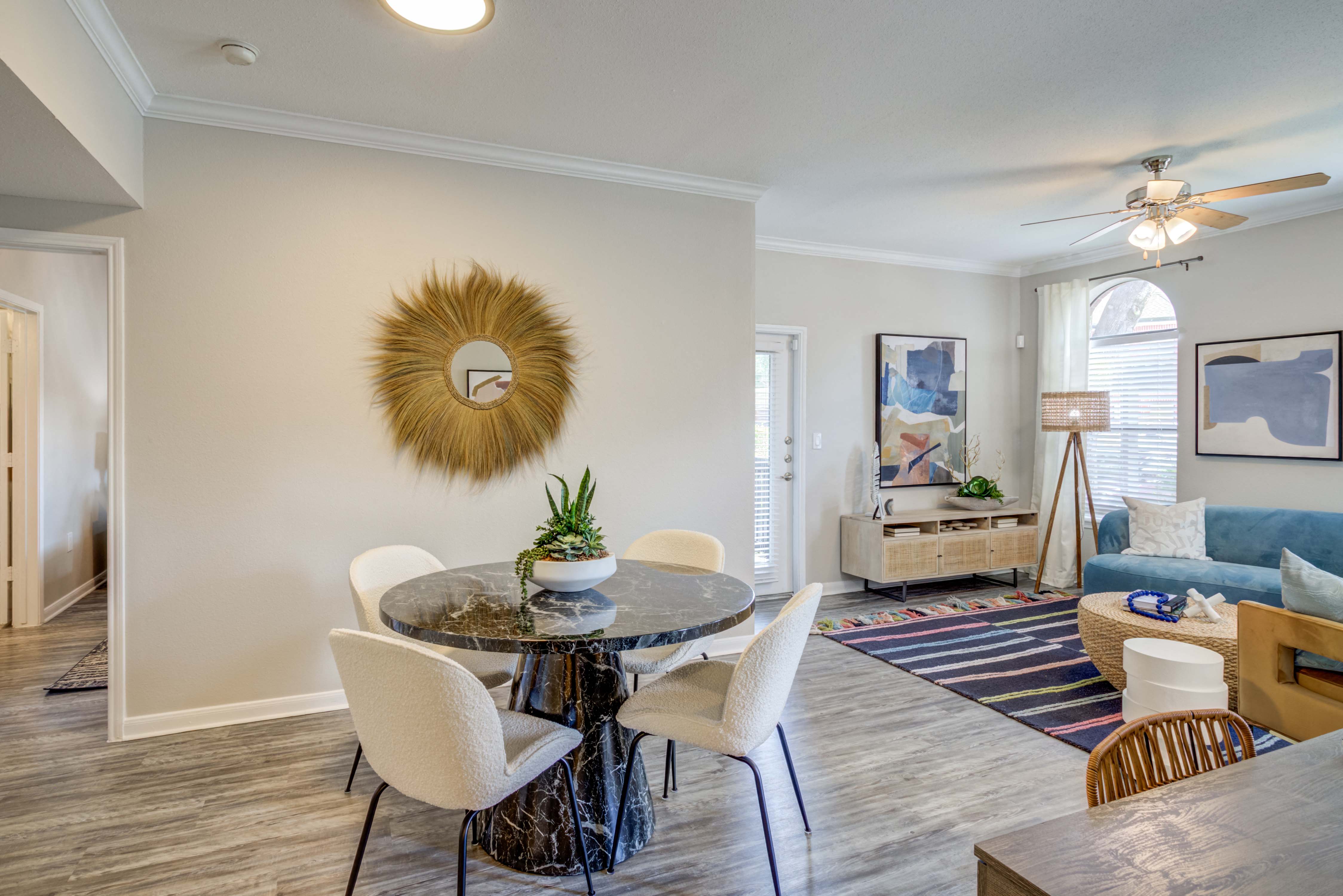 an open living room and dining room with a table and chairs