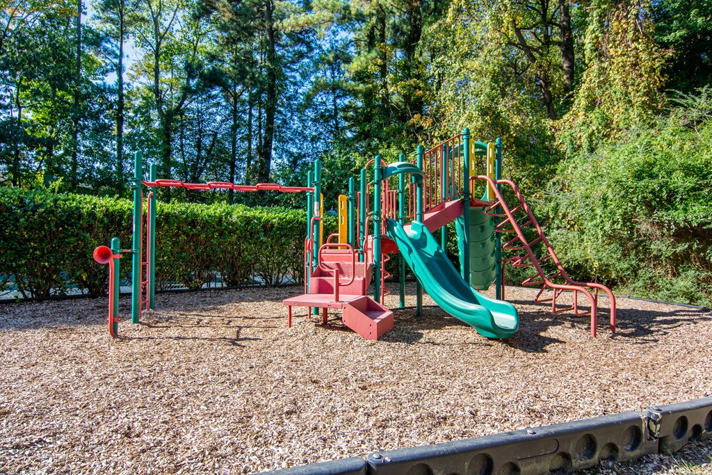 a playground with a slide and other playground equipment