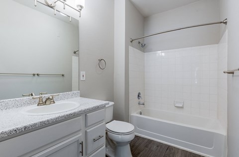 a bathroom with a sink toilet and a bath tub