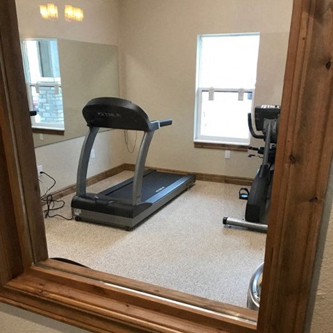 a reflection of a treadmill in a mirror