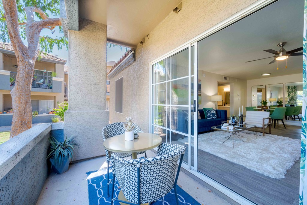 A patio with a table and chairs is shown.