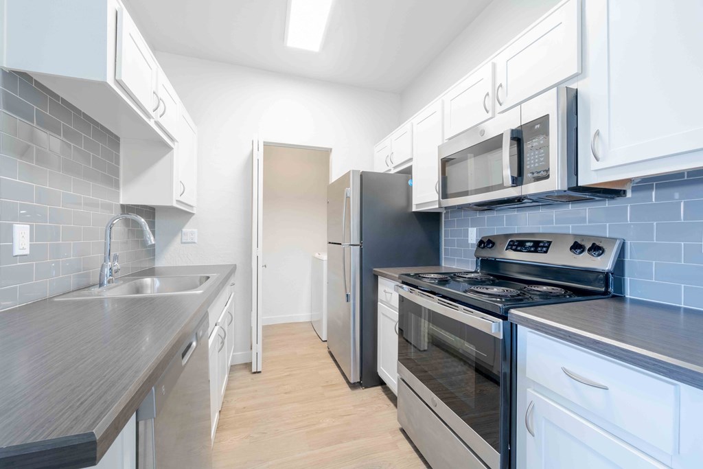 A kitchen with stainless steel appliances.