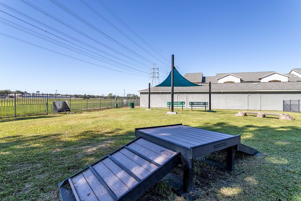 a picnic area with a bench and a picnic table