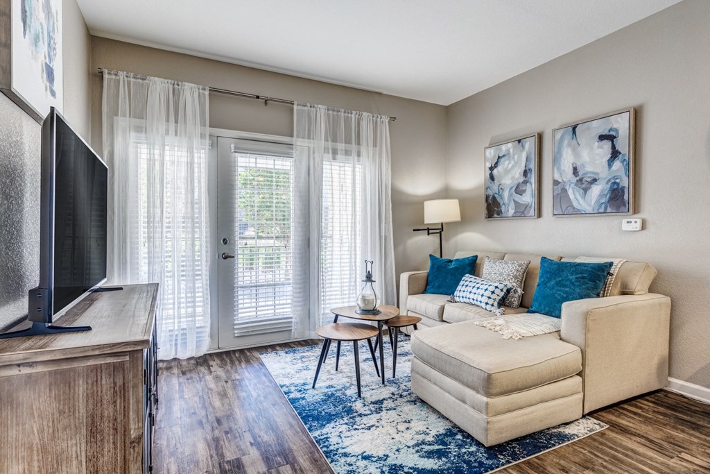 a living room with a couch and a tv