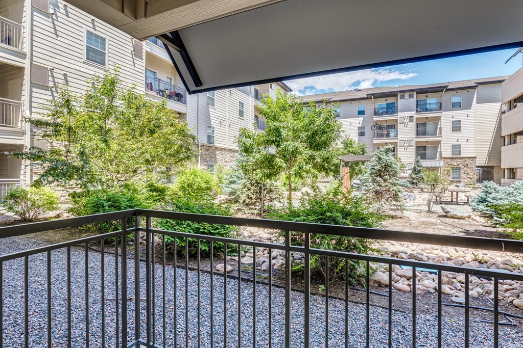 the preserve at ballantyne commons balcony view of trees and apartment buildings