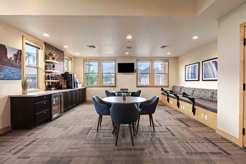 a dining room with a table and chairs