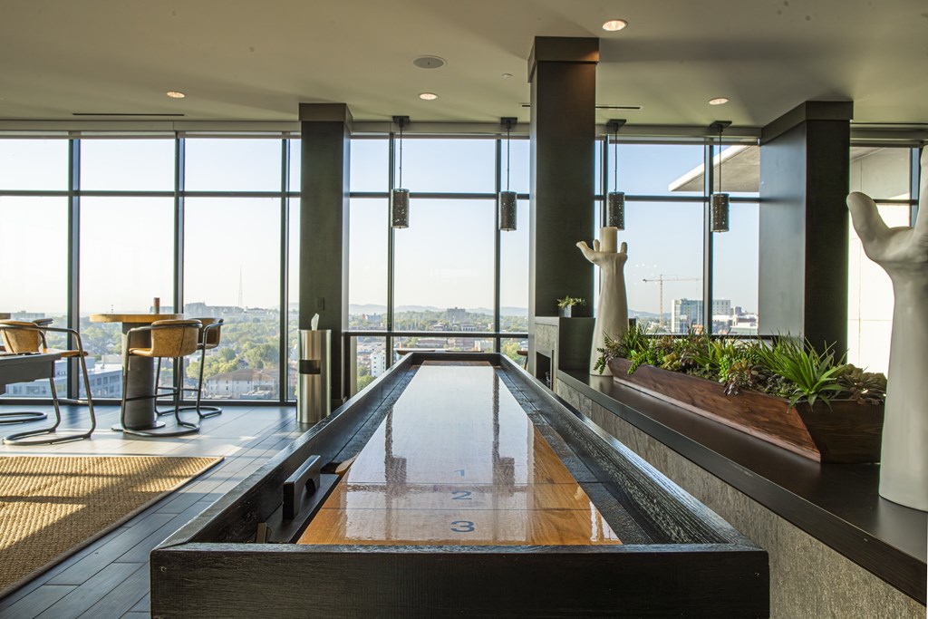 A long table with a pool table in the middle of it.