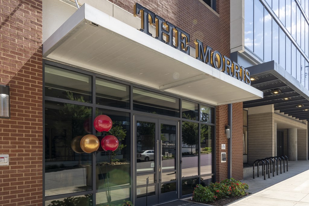 The front of The Morris building with a glass door and windows.