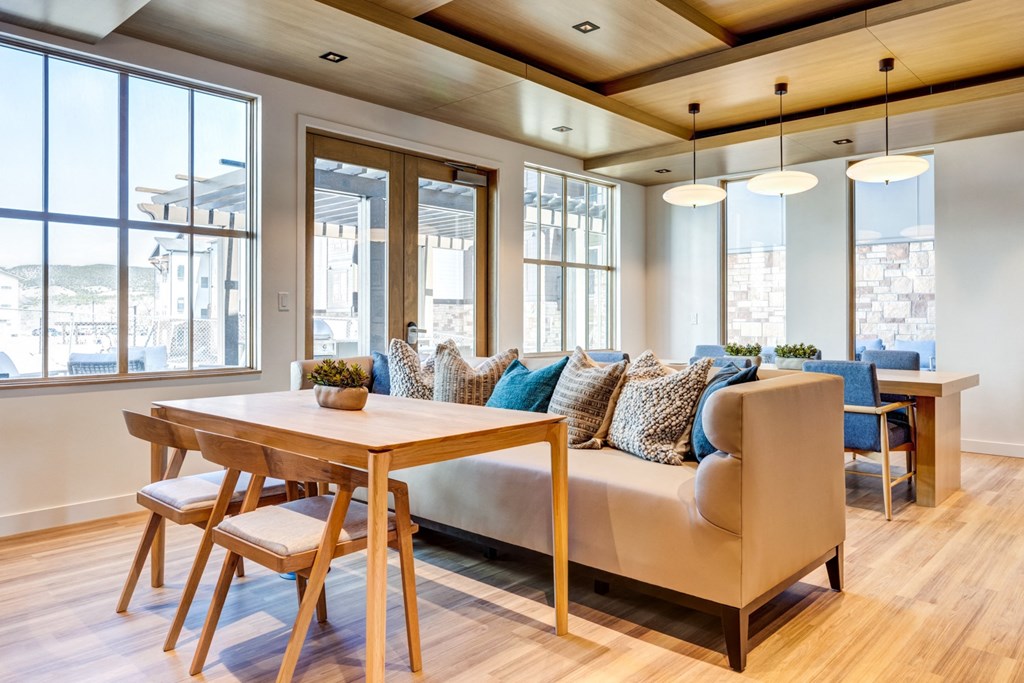 a living room with a couch and a wooden table