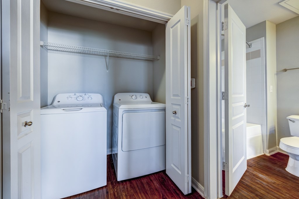 A laundry room with a washer and dryer.