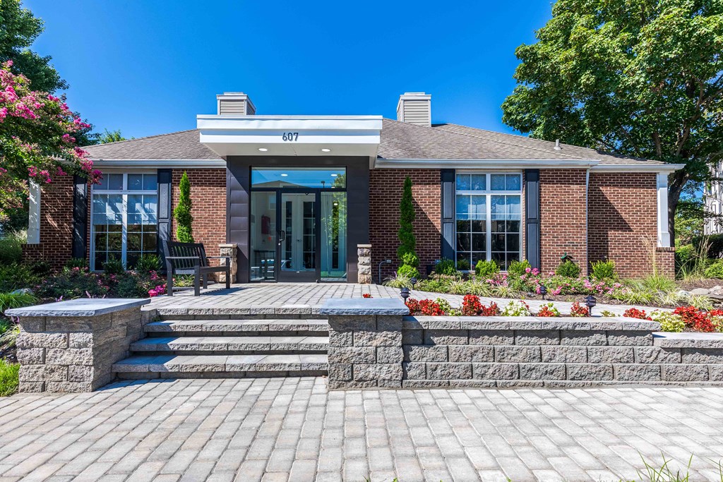 Leasing Center with a stone walkway and steps to the entrance