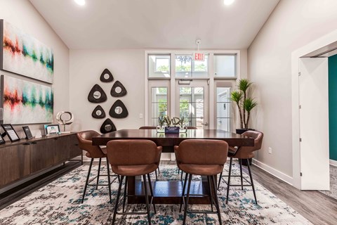 leasing center with a table and chairs and a large window