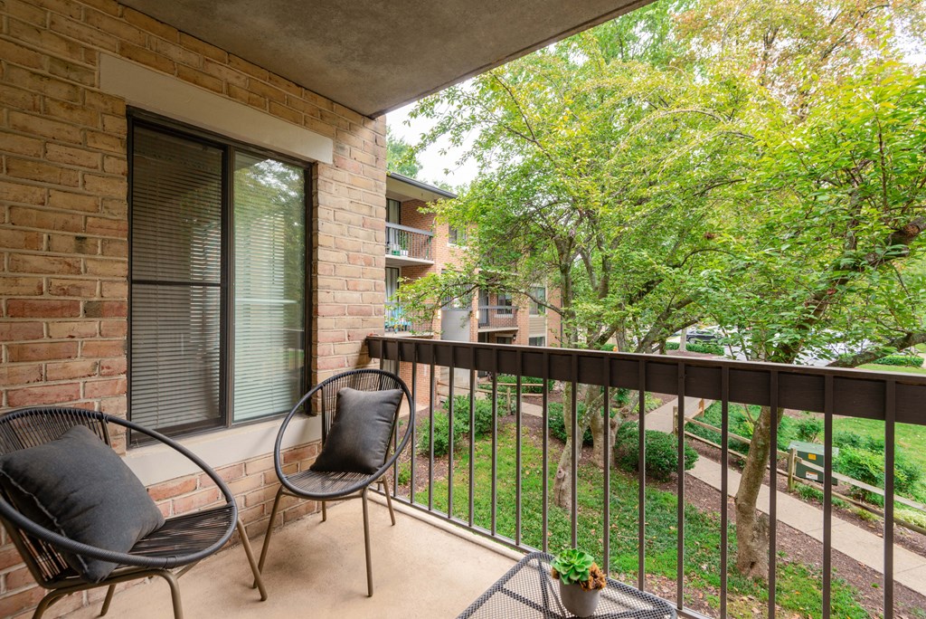 a balcony with chairs