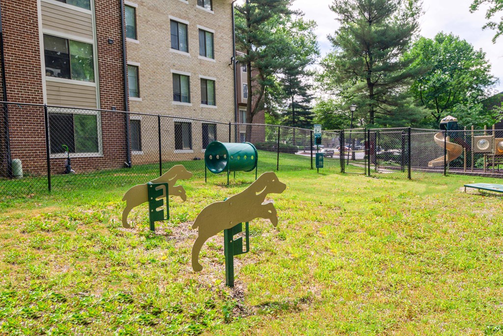 a dog park in front of an apartment building