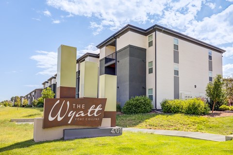 The Wyatt Fort Collins sign is in front of a modern building.
