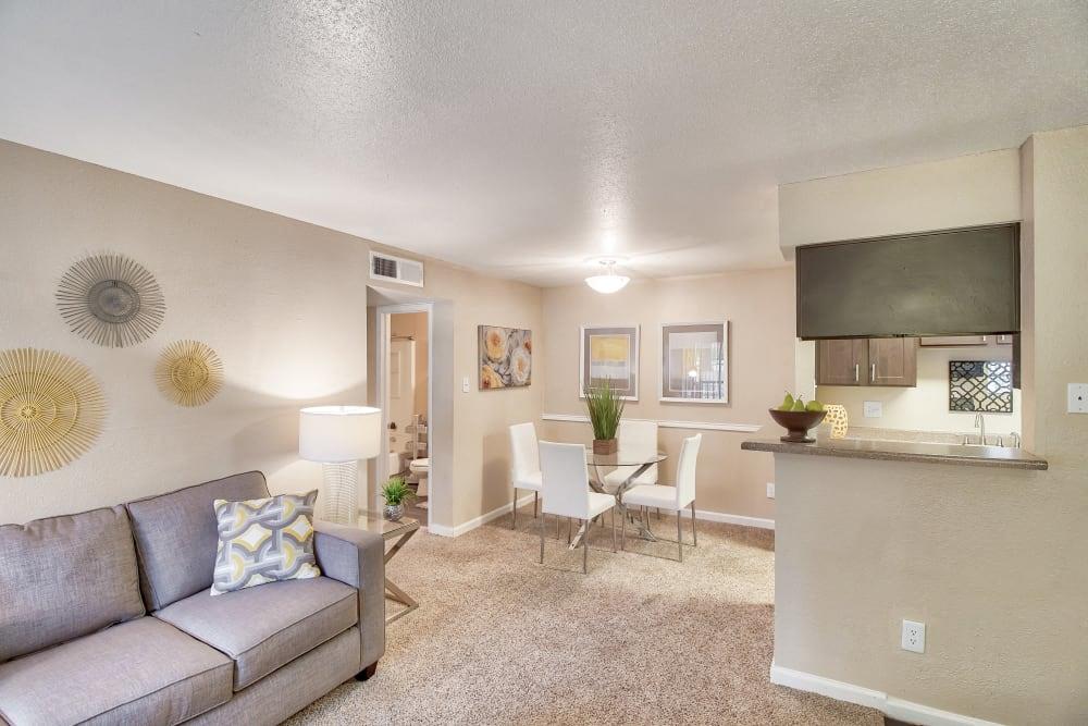 a living room and dining room with a couch and a table
