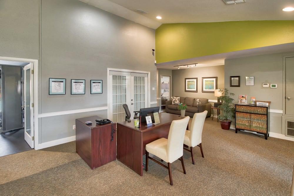 a large office with a desk and chairs