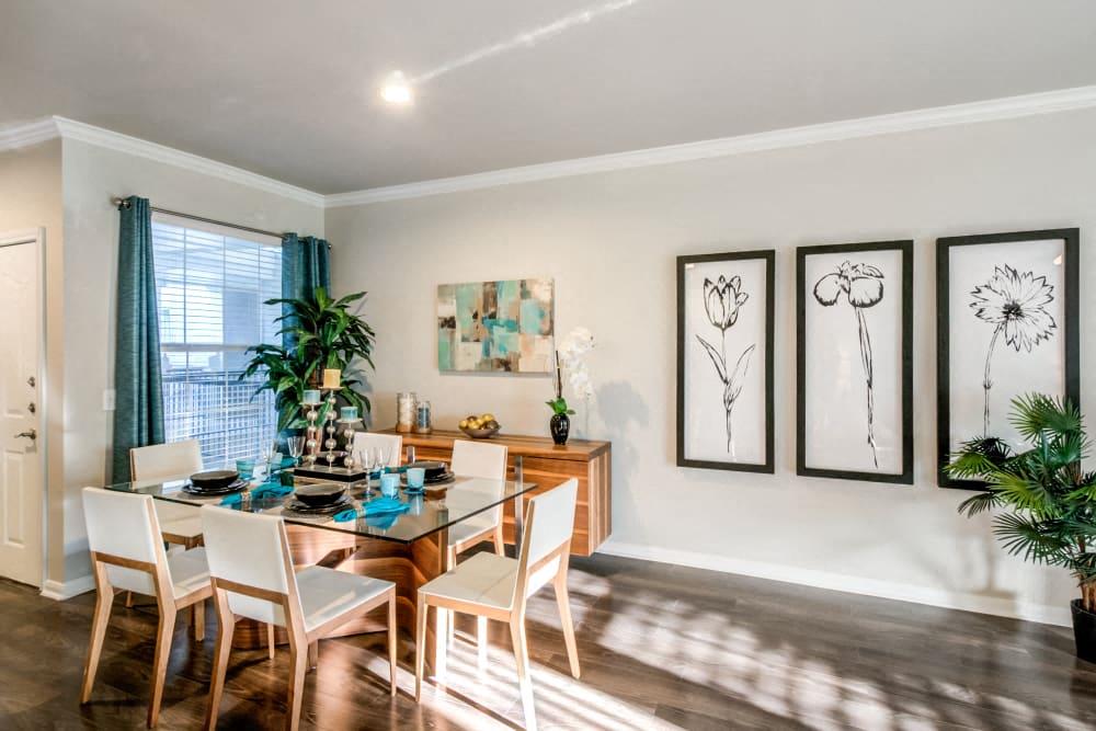 the dining room of a home with a table and chairs