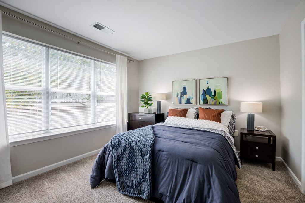 apartments bedroom with large windows