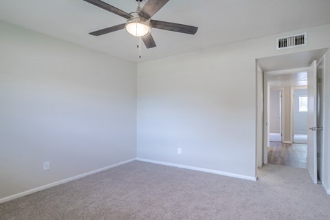 empty bedroom with ceiling fan
