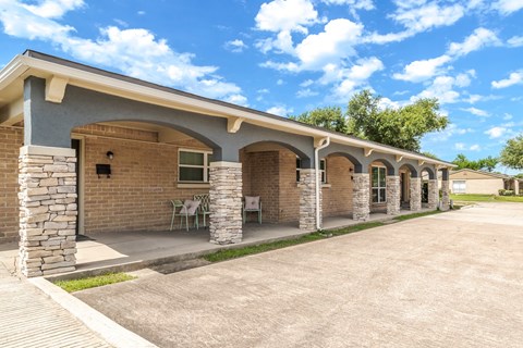 the patio area of the apartment buildings