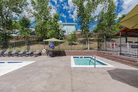 our apartments have a swimming pool and a patio with lounge chairs