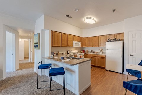 a kitchen with a counter top and a refrigerator