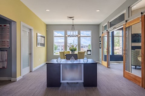 a large office with a desk and a window