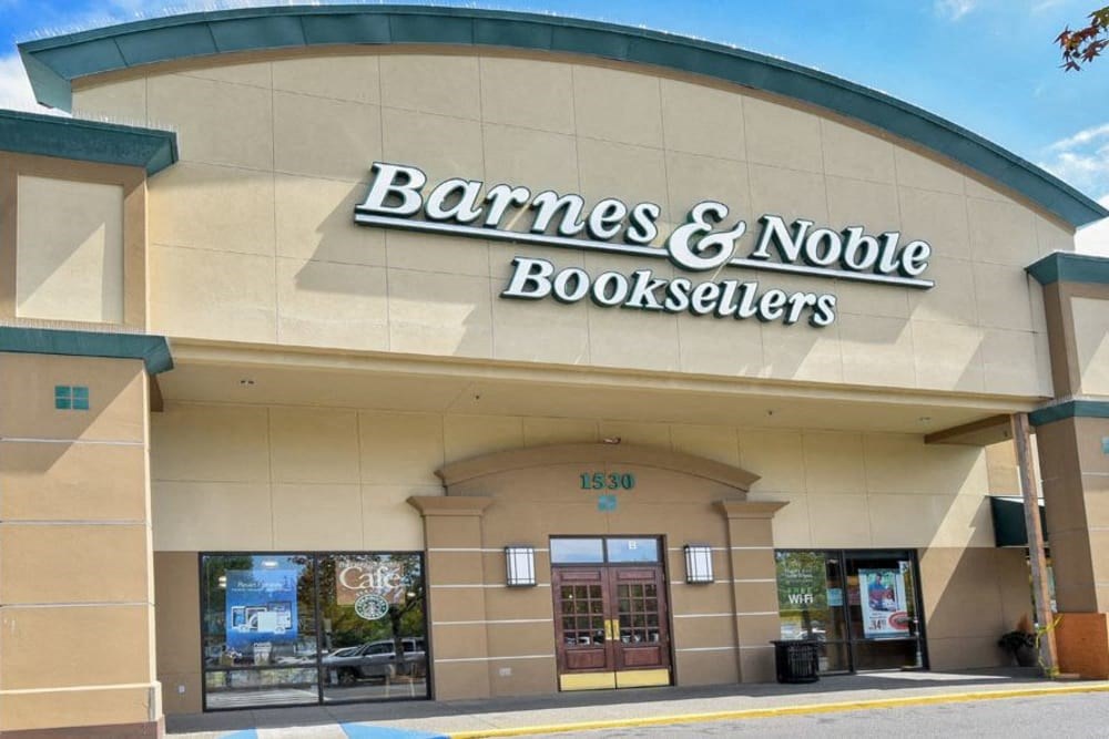 the front of a bookstore with a sign on the building