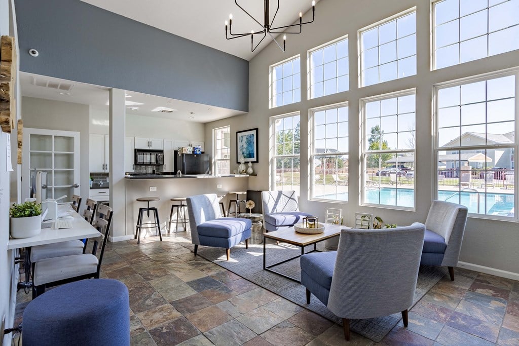 Leasing Center with couches and chairs and a kitchen with a pool