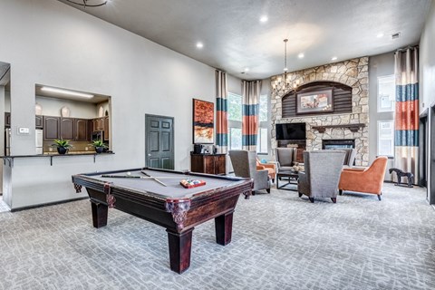 play a game of pool in our clubhouse at our apartments