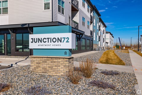 A modern apartment complex named Junction 72 is shown in the image.